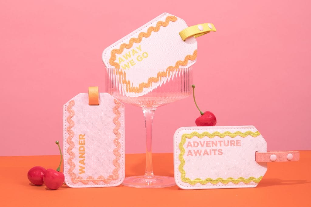 Ric Rac collection luggage tags in bubblegum pink feature embroidered ric rac trim.